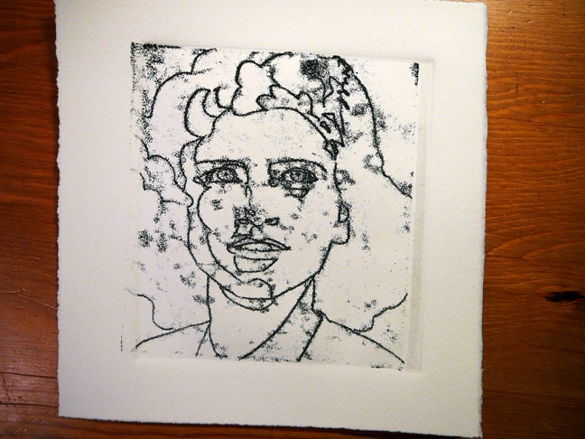 a linear drawing of a woman's face, made via trace monotype with black ink in smoky passages on the paper