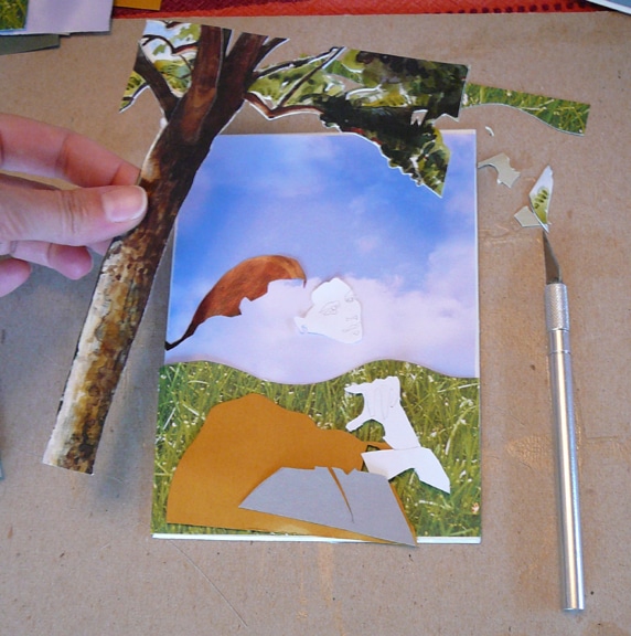 a mat board and construction paper collagraph plate being built