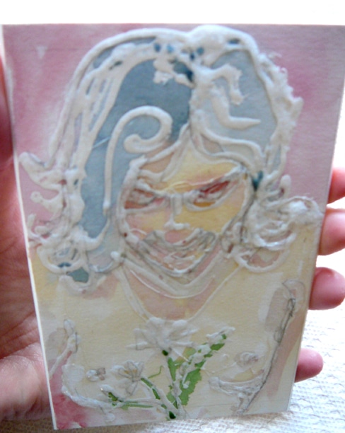 glue collagraph plate of a woman looking down at flowers
