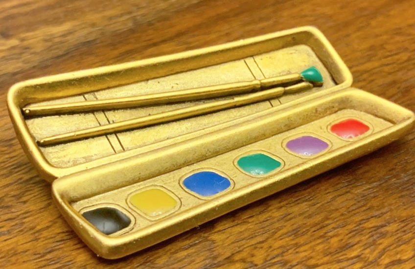 a vintage painter's palette lapel pin for an artist
