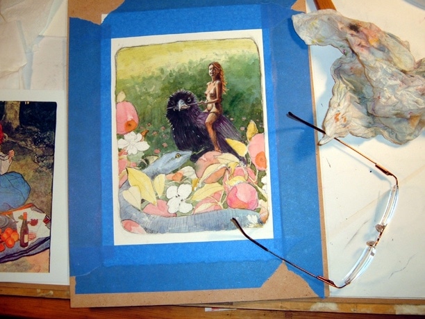 watercolor and charcoal together on a painting in process of a woman riding a crow into a garden, while a blue snake in an apple tree watches her