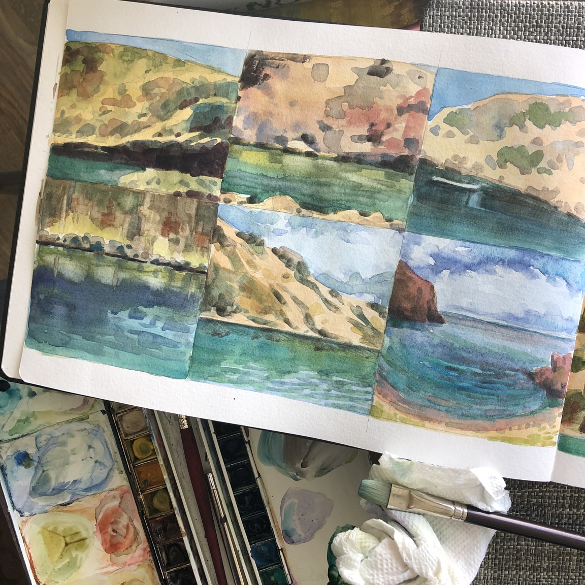 watercolor sketchbook practice with coastal cliff landscape scenes