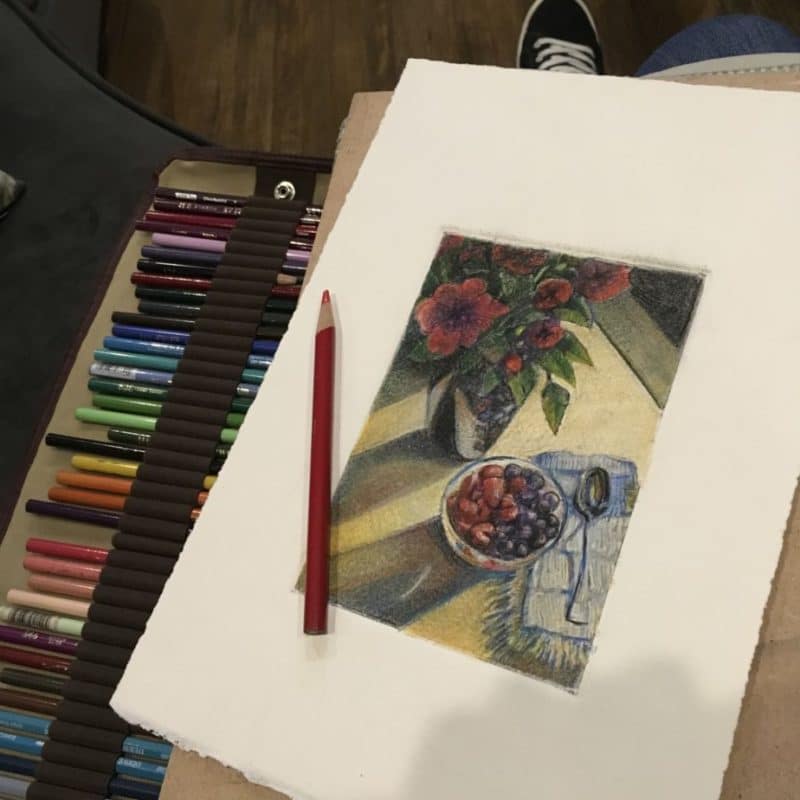 The same monochrome still life of roses and berries, now with color applied with pencils
