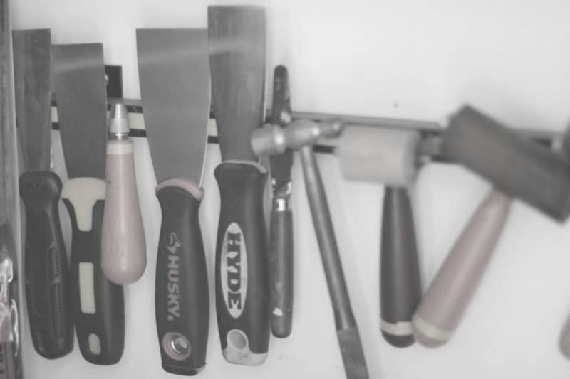 putty knives, carving tools, brayers and palette knives in the studio