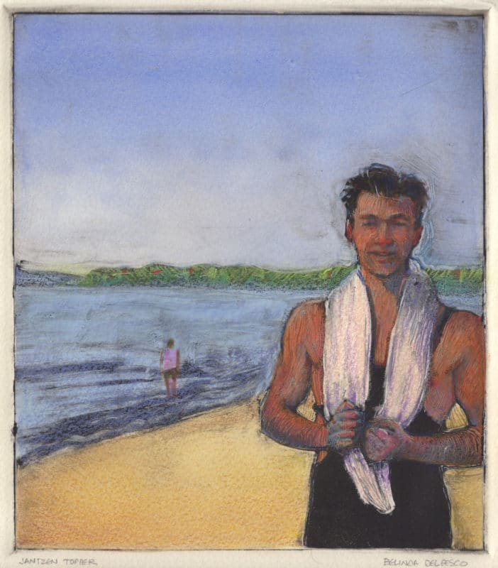a man on the beach with a white towel slung over his neck and a figure in the water behind him