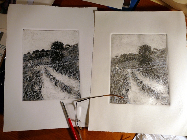 two black and white monotypes of a landscape, with a painter standing in a field at an easel